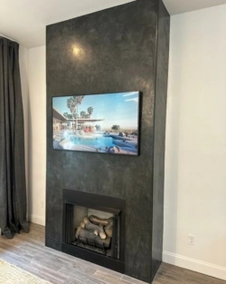 Visual Harmony Studios - Black Venetian Plaster Fireplace